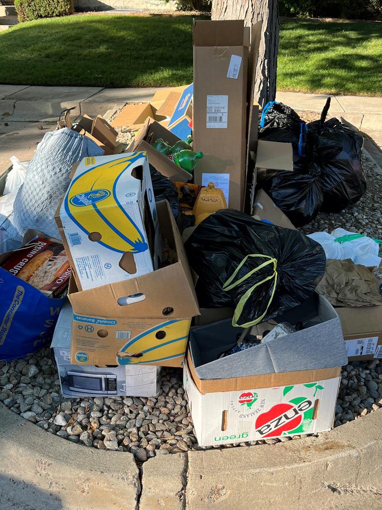 Fire hydrant covered by trash. 